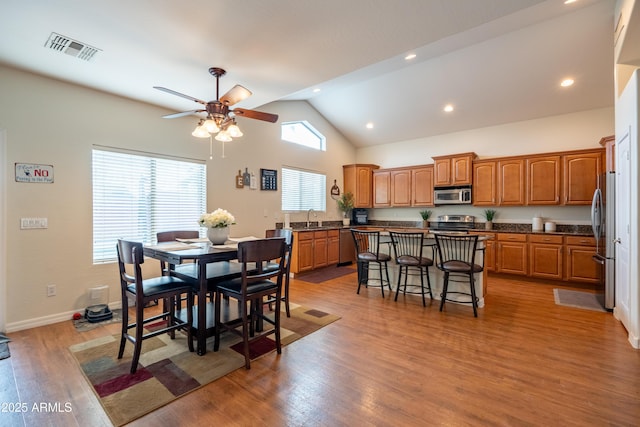 dining area with recessed lighting, visible vents, light wood-style flooring, ceiling fan, and baseboards