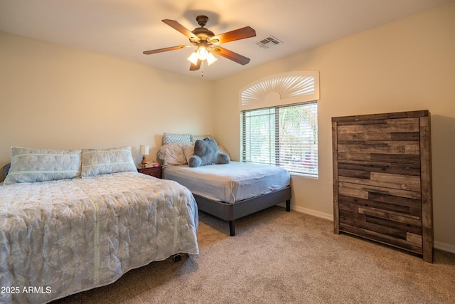 bedroom featuring a ceiling fan, carpet, visible vents, and baseboards