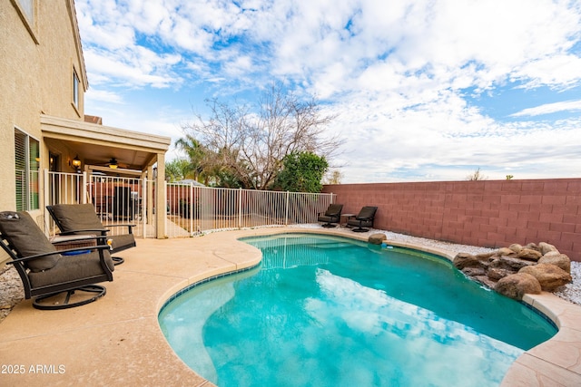 view of swimming pool featuring a fenced in pool, a fenced backyard, and a patio