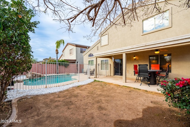 view of swimming pool featuring a patio, fence, and a fenced in pool