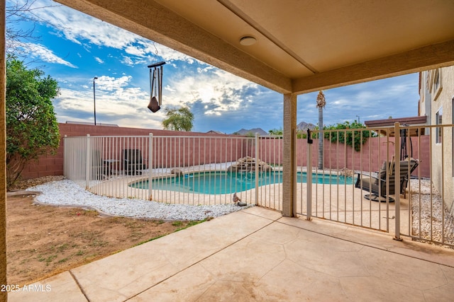 view of pool featuring a patio, a fenced backyard, and a fenced in pool