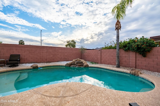 view of swimming pool featuring a fenced backyard and a fenced in pool