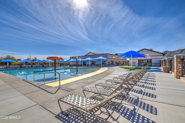 pool featuring a patio and fence