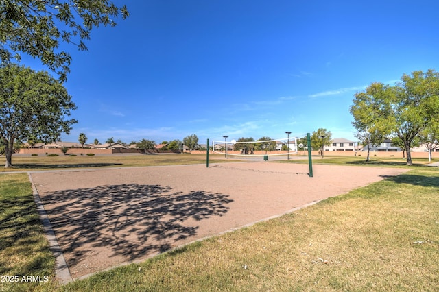 view of home's community featuring a yard and volleyball court