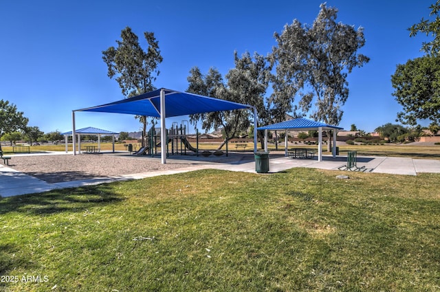 view of property's community featuring a gazebo, playground community, and a lawn