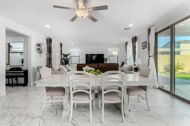 dining space with ceiling fan