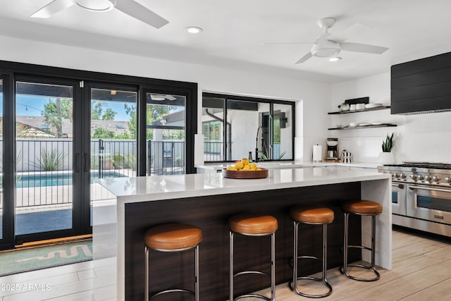 101 E Linger Ln, Phoenix, AZ 85020 - kitchen featuring ceiling fan, double oven range, a sink, light countertops, and recessed lighting
