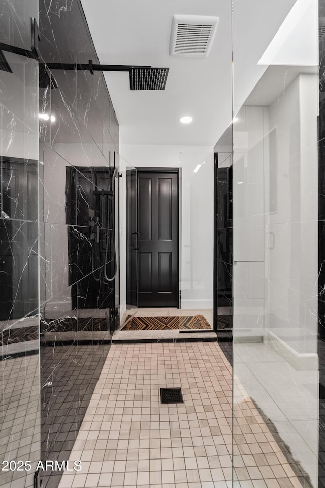 101 E Linger Ln, Phoenix, AZ 85020 - bathroom featuring a marble finish shower, tile patterned flooring, and recessed lighting