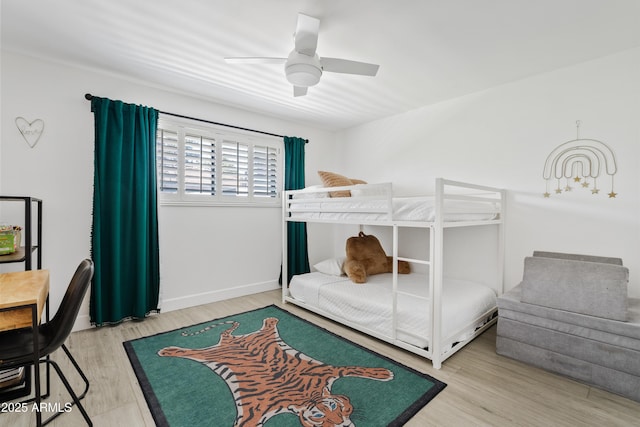 101 E Linger Ln, Phoenix, AZ 85020 - bedroom with wood finished floors, a ceiling fan, and baseboards