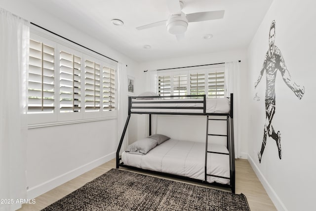 101 E Linger Ln, Phoenix, AZ 85020 - bedroom featuring wood finished floors, baseboards, and a ceiling fan