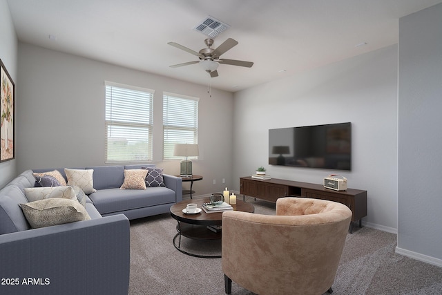 living room featuring baseboards, visible vents, ceiling fan, and carpet flooring