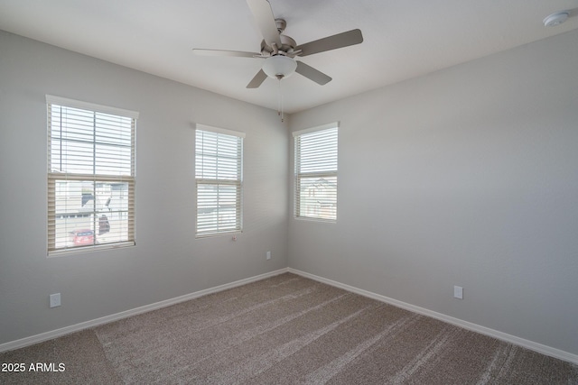 unfurnished room featuring ceiling fan, baseboards, and carpet flooring