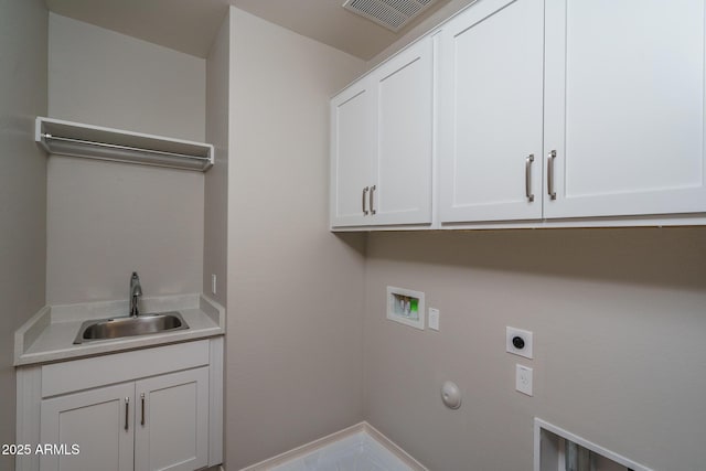 laundry room featuring cabinet space, visible vents, a sink, hookup for a washing machine, and electric dryer hookup