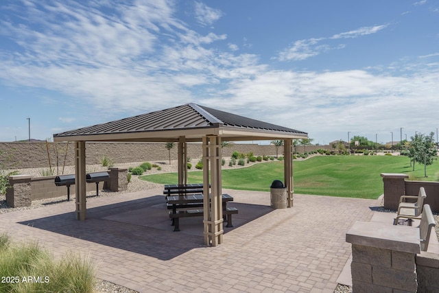 surrounding community featuring a lawn, a gazebo, and a patio