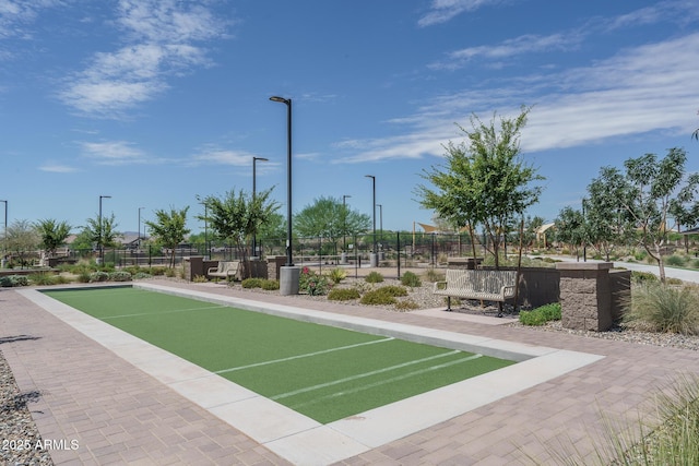 view of property's community with fence