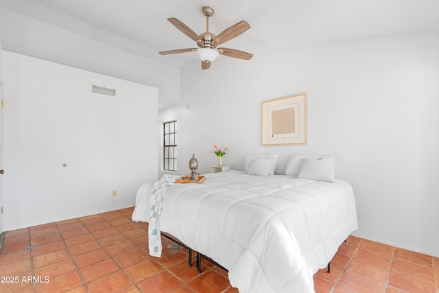 bedroom with vaulted ceiling and ceiling fan