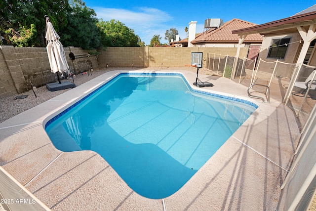 view of swimming pool featuring a patio