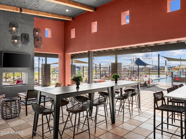 view of patio featuring fence and outdoor dining space