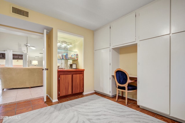 bedroom featuring light tile patterned floors