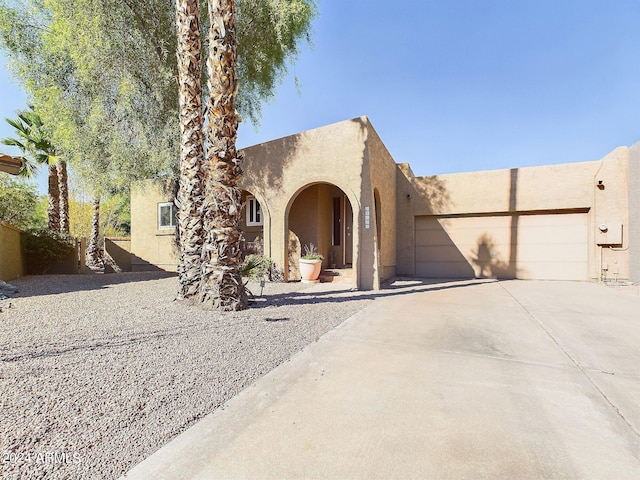 southwest-style home with a garage