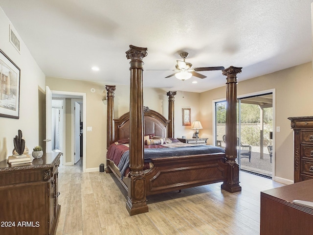 bedroom with ceiling fan, access to exterior, a textured ceiling, and light hardwood / wood-style flooring