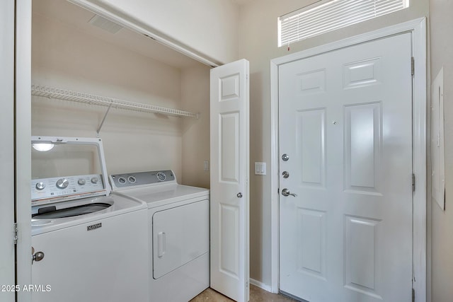 laundry area with separate washer and dryer and laundry area