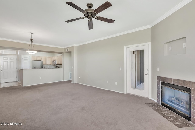unfurnished living room with baseboards, crown molding, and carpet