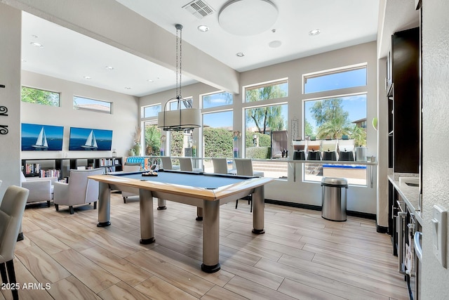 game room featuring light wood finished floors, visible vents, and recessed lighting