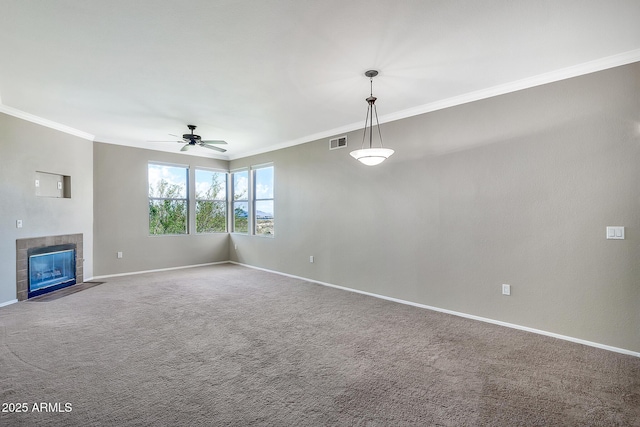 unfurnished living room featuring a ceiling fan, baseboards, crown molding, and visible vents