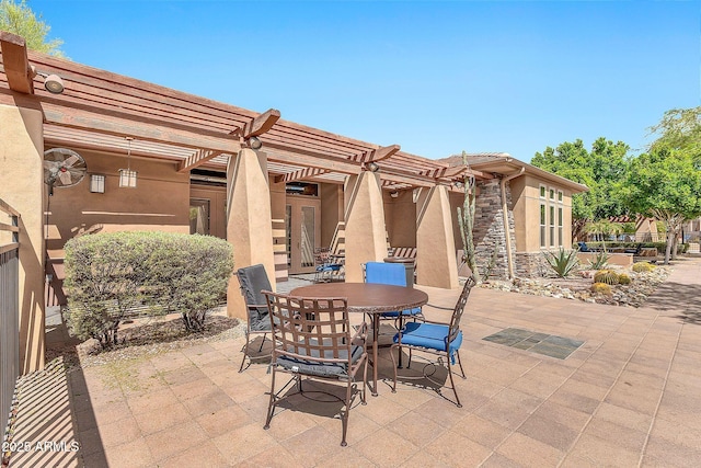 view of patio / terrace featuring a pergola and outdoor dining space