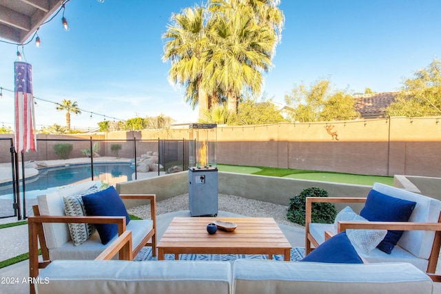 view of patio / terrace featuring a fenced backyard, outdoor lounge area, and a fenced in pool