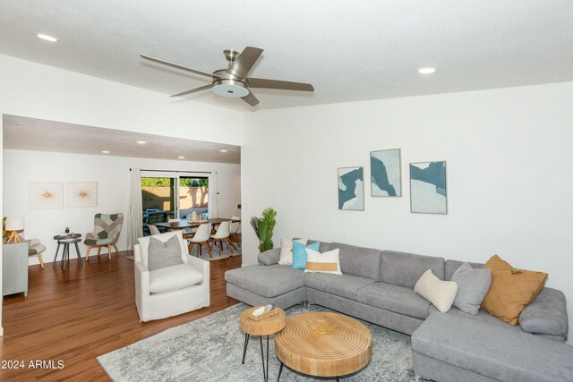 living area with recessed lighting, ceiling fan, and wood finished floors