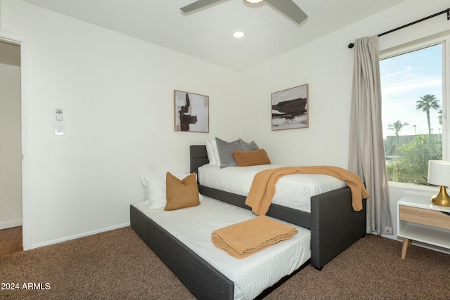 carpeted bedroom featuring ceiling fan, multiple windows, recessed lighting, and baseboards