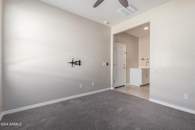 1952 N 212th Ln, Buckeye, AZ 85396 - unfurnished room featuring visible vents, baseboards, ceiling fan, and light carpet