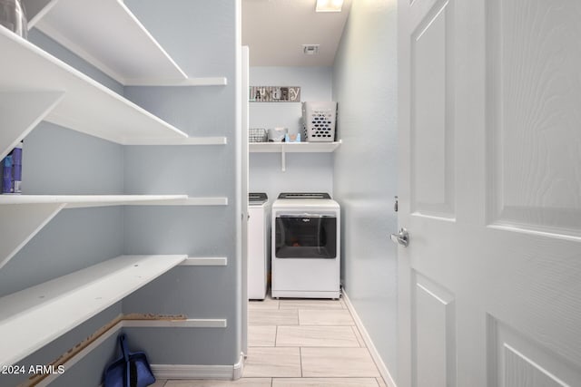 1952 N 212th Ln, Buckeye, AZ 85396 - laundry room featuring baseboards, visible vents, laundry area, and washer and dryer