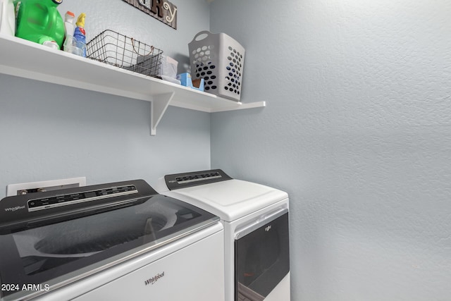 1952 N 212th Ln, Buckeye, AZ 85396 - clothes washing area with laundry area, a textured wall, and washing machine and clothes dryer