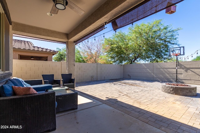1952 N 212th Ln, Buckeye, AZ 85396 - view of patio featuring a ceiling fan, a fire pit, and a fenced backyard