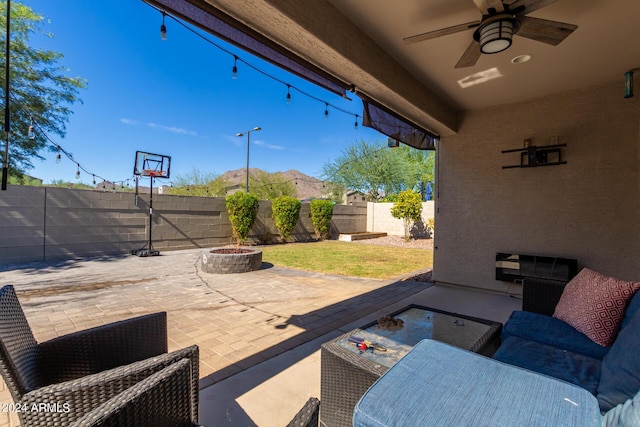 1952 N 212th Ln, Buckeye, AZ 85396 - view of patio / terrace with a fenced backyard, a ceiling fan, and an outdoor fire pit