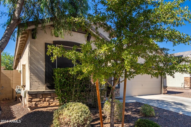 1952 N 212th Ln, Buckeye, AZ 85396 - view of front of home with stucco siding and driveway