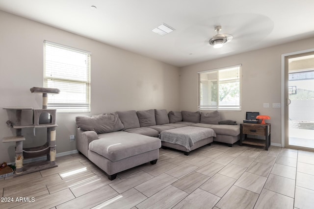1952 N 212th Ln, Buckeye, AZ 85396 - living area featuring baseboards, a ceiling fan, wood finish floors, and visible vents