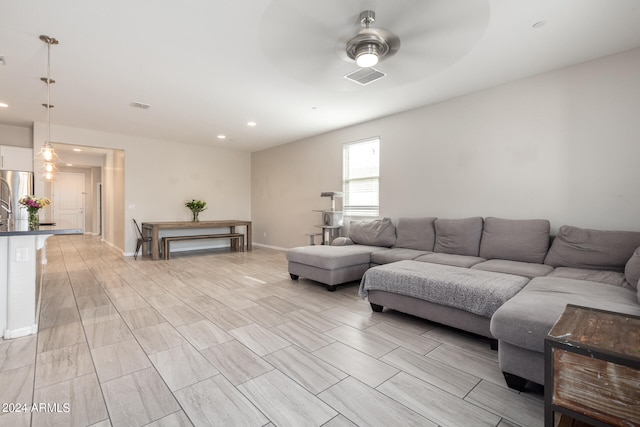 living room featuring ceiling fan