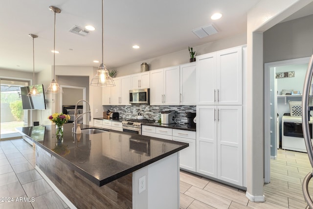 1952 N 212th Ln, Buckeye, AZ 85396 - kitchen with visible vents, a sink, tasteful backsplash, and stainless steel appliances