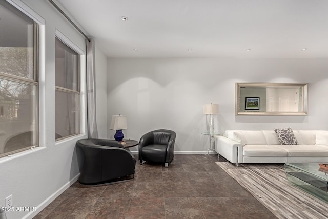 living room with recessed lighting and baseboards