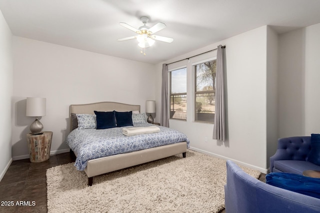 bedroom featuring a ceiling fan and baseboards