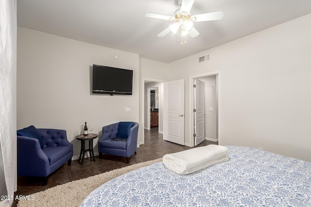 tiled bedroom with baseboards, visible vents, and a ceiling fan