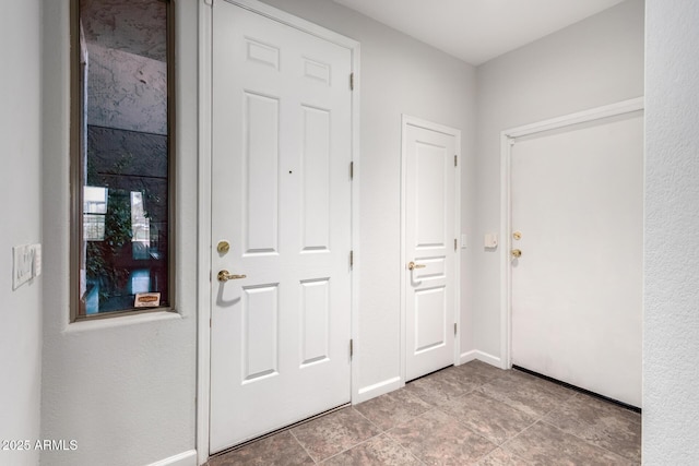 foyer with baseboards