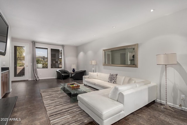 living room with recessed lighting and baseboards