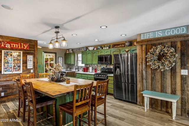 541 W Deuce Of Clubs, Show Low, AZ 85901 - dining room with wood walls, light wood-type flooring, and recessed lighting