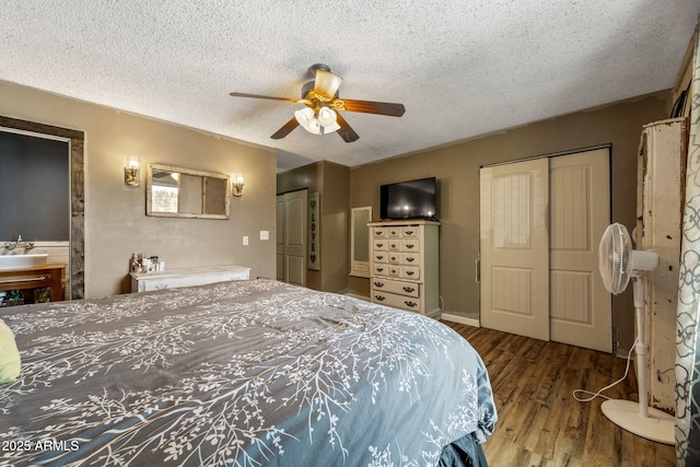 541 W Deuce Of Clubs, Show Low, AZ 85901 - bedroom with a textured ceiling, wood finished floors, and ceiling fan