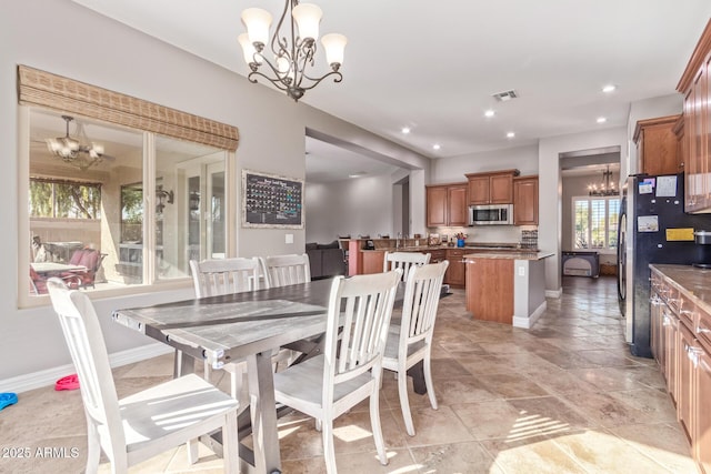 dining area with a notable chandelier